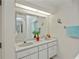 Bathroom with double sinks, framed mirrors, and good lighting at 4339 Boggs St, Port Charlotte, FL 33948