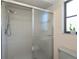 Bathroom featuring tiled walk-in shower and window at 4339 Boggs St, Port Charlotte, FL 33948