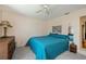 Cozy bedroom features soft carpet, ceiling fan and relaxing decor at 4339 Boggs St, Port Charlotte, FL 33948