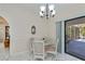 Dining room with a sliding glass door to a screened patio at 4339 Boggs St, Port Charlotte, FL 33948