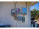 Electrical panel on the exterior wall with a meter, power inverter and warning labels at 4339 Boggs St, Port Charlotte, FL 33948