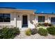 Inviting home entrance with a well-manicured garden featuring a variety of colorful plants at 4339 Boggs St, Port Charlotte, FL 33948