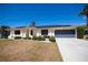 Charming single-story home with well-maintained landscaping and a two-car garage at 4339 Boggs St, Port Charlotte, FL 33948