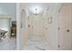 Bright hallway with marble tile floor, arches, and a front door at 4339 Boggs St, Port Charlotte, FL 33948