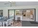 View from the lanai through the open kitchen to the living room at 4339 Boggs St, Port Charlotte, FL 33948