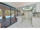 Open kitchen and dining area with sliding glass doors to the lanai at 4339 Boggs St, Port Charlotte, FL 33948