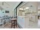 Kitchen with bar open to the patio and dining area at 4339 Boggs St, Port Charlotte, FL 33948