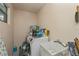 Functional laundry room equipped with a washer, dryer, sink and window, ideal for household tasks at 4339 Boggs St, Port Charlotte, FL 33948