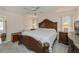 Traditional-style main bedroom with carpet floors, white bedding, and a ceiling fan at 4339 Boggs St, Port Charlotte, FL 33948