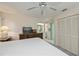 Spacious main bedroom with a dresser and a view to the en suite bathroom and closet at 4339 Boggs St, Port Charlotte, FL 33948
