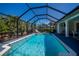 Beautiful screened-in pool surrounded by lush landscaping at 4339 Boggs St, Port Charlotte, FL 33948
