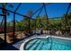 Enclosed pool featuring stairs, a seating area, and landscaped garden views at 4339 Boggs St, Port Charlotte, FL 33948