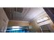 Bathroom with decorative ceiling tiles, updated lighting and new shower curtain at 570 Mimosa Nw Ave, Port Charlotte, FL 33952