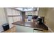 Functional kitchen featuring tiled floors, ample counter space, and white cabinets at 570 Mimosa Nw Ave, Port Charlotte, FL 33952
