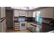 Cozy kitchen featuring tiled floors, ample counter space, and modern appliances at 570 Mimosa Nw Ave, Port Charlotte, FL 33952