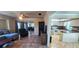 Open-concept living area flowing into the kitchen, featuring tile flooring at 570 Mimosa Nw Ave, Port Charlotte, FL 33952