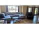 Comfortable living room featuring a large sectional and tile flooring at 570 Mimosa Nw Ave, Port Charlotte, FL 33952
