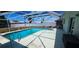 Inviting screened-in pool area, perfect for outdoor enjoyment and relaxation at 570 Mimosa Nw Ave, Port Charlotte, FL 33952