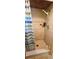Modern shower featuring decorative tiles, a handheld shower head, and a striped shower curtain at 570 Mimosa Nw Ave, Port Charlotte, FL 33952