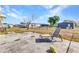 An empty backyard with a small concrete patio and minimal vegetation in the yard at 6144 Redwing Ave, Englewood, FL 34224