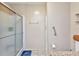 Bathroom showcasing shower, built-in storage, grab bar and toilet at 6144 Redwing Ave, Englewood, FL 34224