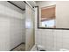 Bathroom with shower and tile throughout at 6604 Ranger Dr, Tampa, FL 33615