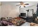 A spacious bedroom with a ceiling fan, television, and dresser, offering a relaxing retreat at 6604 Ranger Dr, Tampa, FL 33615