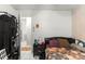 A bedroom with a bed, nightstand, and closet space, providing a private and functional area at 6604 Ranger Dr, Tampa, FL 33615