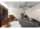 This bedroom features a ceiling fan and neutral walls at 6604 Ranger Dr, Tampa, FL 33615