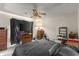 This bedroom features a ceiling fan and neutral walls at 6604 Ranger Dr, Tampa, FL 33615