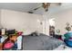 This bedroom features a ceiling fan and neutral walls at 6604 Ranger Dr, Tampa, FL 33615