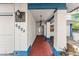 Covered entrance to home with pillars and a tiled floor at 6604 Ranger Dr, Tampa, FL 33615