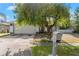 Home exterior with a tree shading the driveway, and a mailbox in front at 6604 Ranger Dr, Tampa, FL 33615