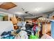 An untidy garage filled with boxes and various items, demonstrating the storage space available at 6604 Ranger Dr, Tampa, FL 33615