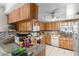Kitchen with abundant wood cabinets, granite countertops, and tile backsplash at 6604 Ranger Dr, Tampa, FL 33615