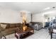 Bright living room with tile floors, two sofas and a shell painting on the wall at 6604 Ranger Dr, Tampa, FL 33615