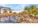 Backyard pond with clear water, rock features and an inviting swing at 6753 Thorman Rd, Port Charlotte, FL 33981
