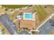 Overhead view of the pool with lounge chairs, clubhouse with picnic tables, and parking at 6753 Thorman Rd, Port Charlotte, FL 33981