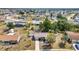 Aerial view of home with landscaping, mature trees, and grass at 6753 Thorman Rd, Port Charlotte, FL 33981