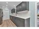 Kitchen featuring grey cabinets, light countertops and stainless steel appliances at 6753 Thorman Rd, Port Charlotte, FL 33981