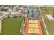 Aerial view of tennis courts and community pool at 6753 Thorman Rd, Port Charlotte, FL 33981