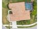 Aerial view of a home featuring a private screened-in pool and manicured backyard at 857 Macaw Cir, Venice, FL 34285