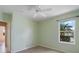 Bedroom with laminate flooring, white trim, and a ceiling fan at 857 Macaw Cir, Venice, FL 34285