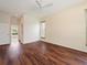 Spacious bedroom boasts wood floors, a ceiling fan, and ample natural light at 857 Macaw Cir, Venice, FL 34285