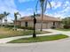 Charming single-Gathering home with well-maintained landscaping, a tiled roof, and a two-car garage at 857 Macaw Cir, Venice, FL 34285