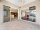 Covered patio provides access to the kitchen and living room through sliding glass doors at 857 Macaw Cir, Venice, FL 34285