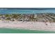 A coastal property features a waterfront community near a sandy beach at 9390 Little Gasparilla Island, Placida, FL 33946