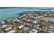 Aerial view highlighting the location of the beach home within a vibrant coastal community near the Gulf at 9390 Little Gasparilla Island, Placida, FL 33946