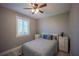 A compact, naturally lit bedroom featuring twin bedside dressers and coordinating color scheme at 9390 Little Gasparilla Island, Placida, FL 33946