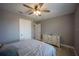 A serene bedroom featuring a neutral palette and a view of the hallway through an open door at 9390 Little Gasparilla Island, Placida, FL 33946